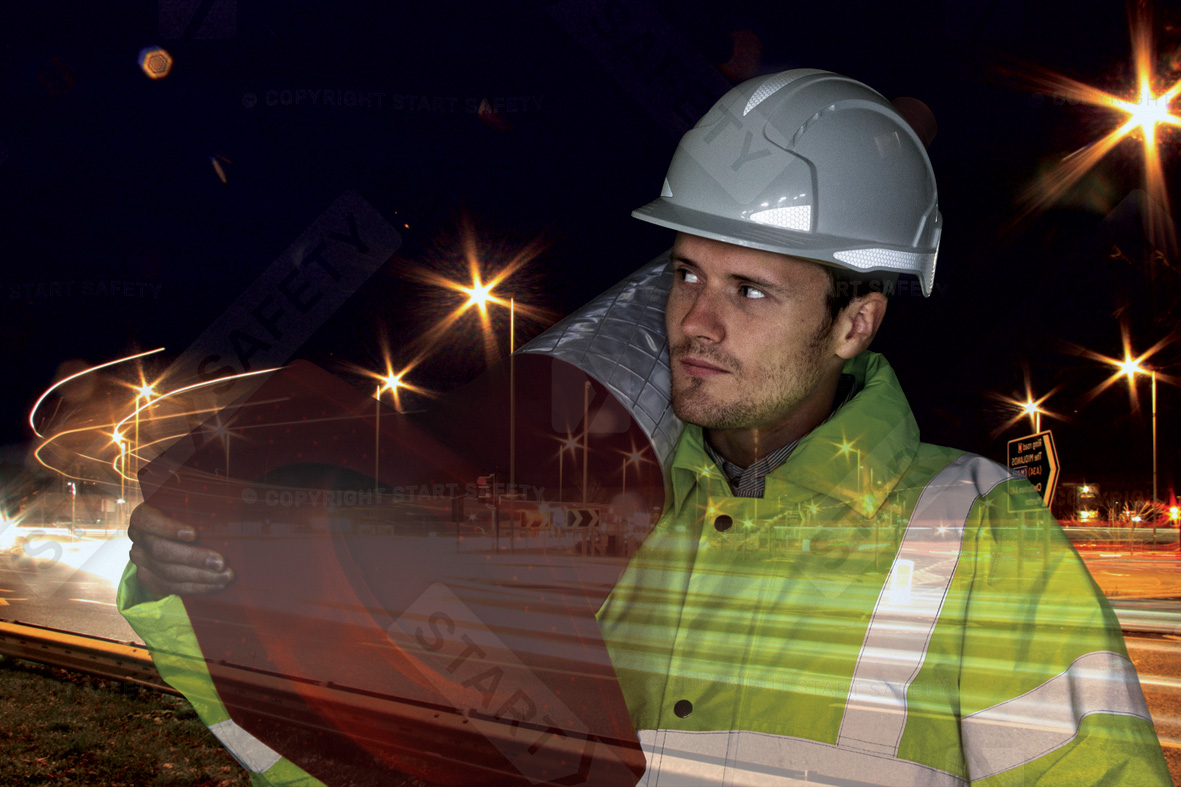 Streetworks Worker At Night Requiring Highest Grade of Hight Visibility Clothing